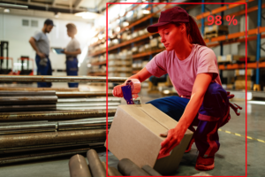 female-warehouse-worker-taping-cardboard-box-with-tape-dispenser-before-shipment